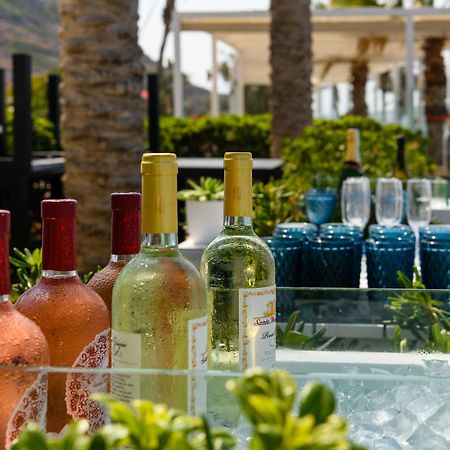 Minos Imperial Luxury Beach Resort & Spa Milatos Exterior photo Wine at a poolside bar