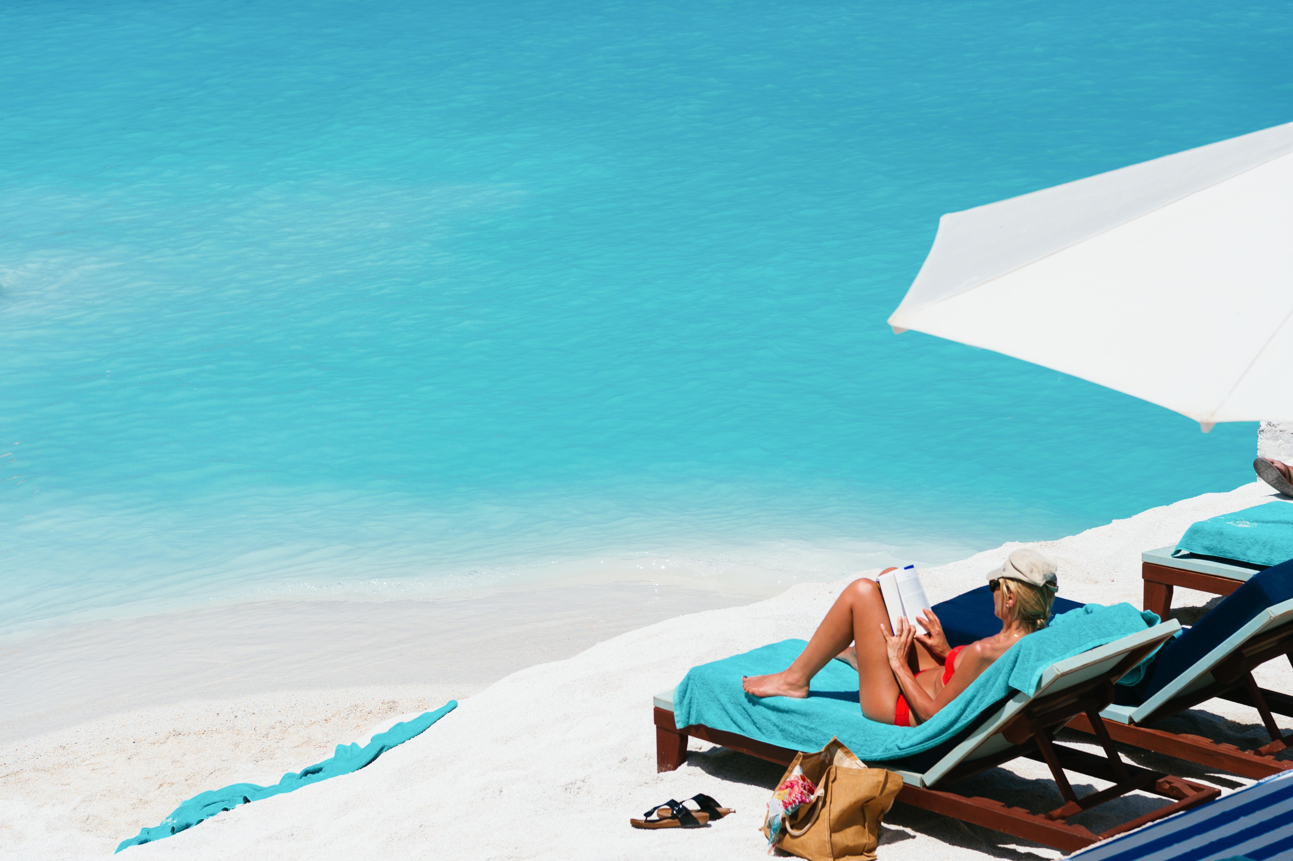 Minos Imperial Luxury Beach Resort & Spa Milatos Exterior photo A woman sunbathing on a beach