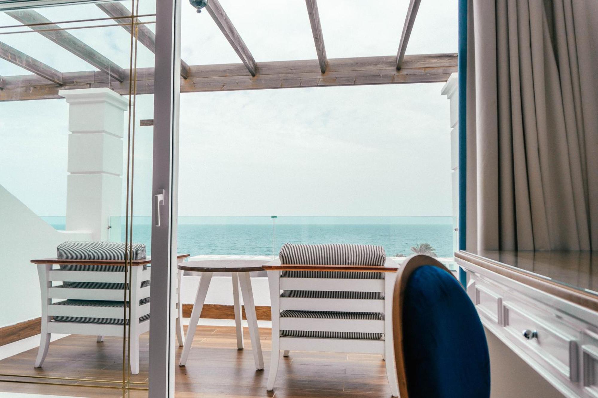 Minos Imperial Luxury Beach Resort & Spa Milatos Exterior photo A view from the balcony of a suite on board the World Voyager